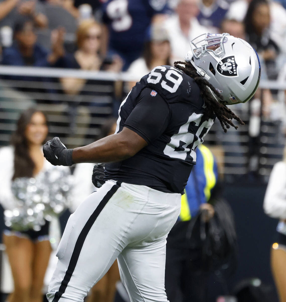 Raiders defensive tackle Adam Butler (69) reacts after sucking New England Patriots quarterback ...