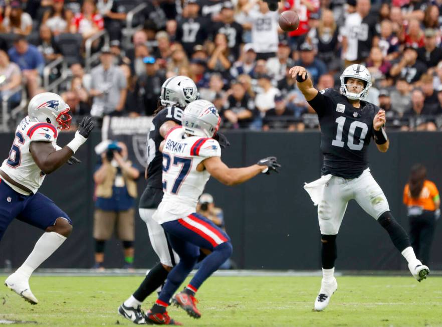 Raiders quarterback Jimmy Garoppolo (10) throws under pressure during an NFL football game agai ...