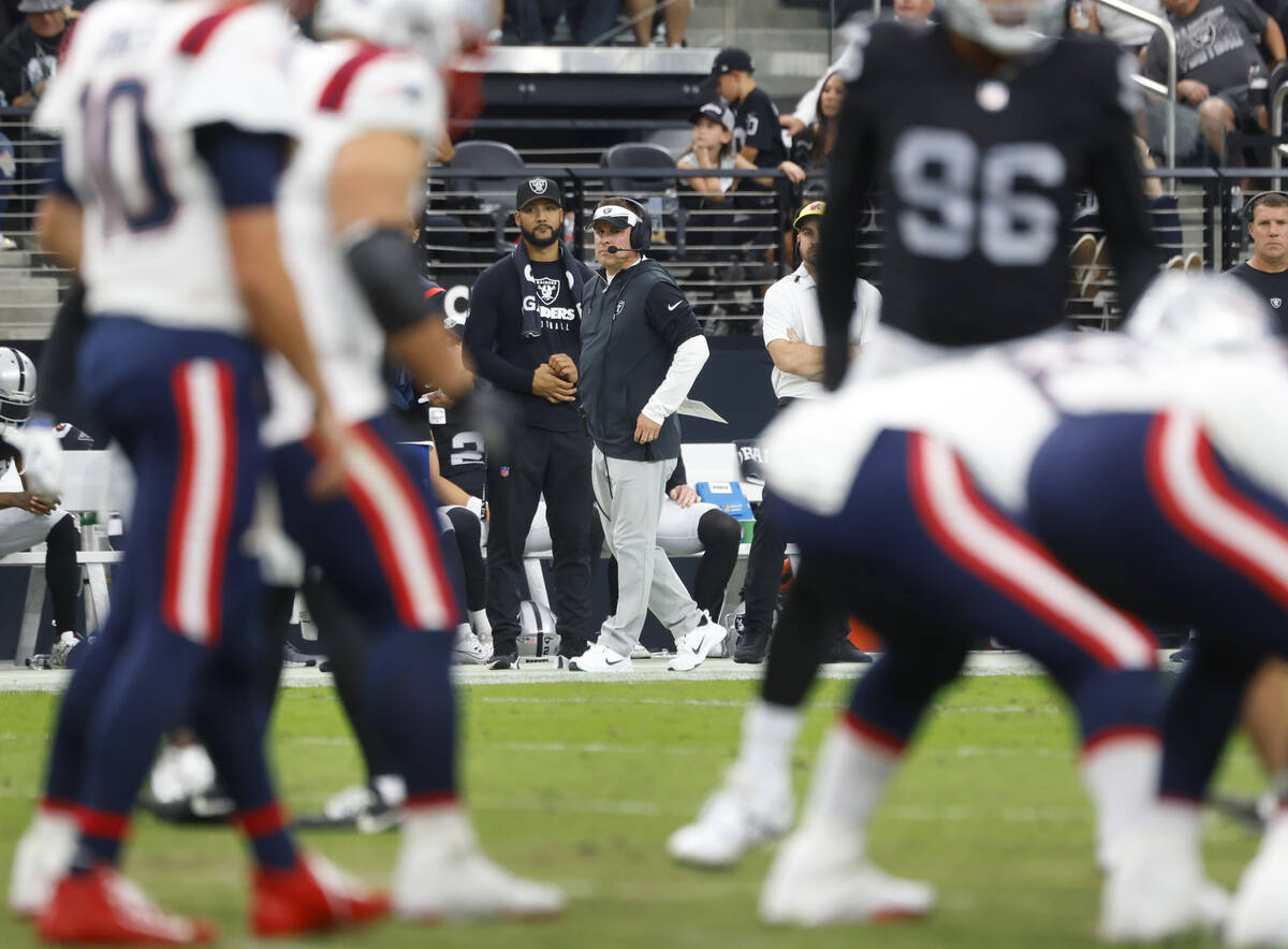 Raiders head coach Josh McDaniels watches New England Patriots' formations during the first hal ...