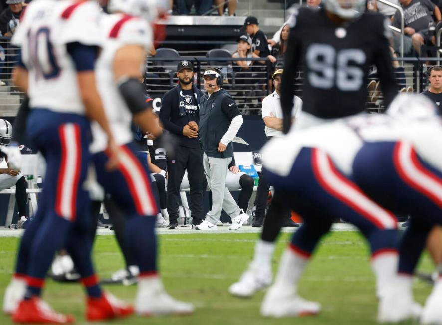 Raiders head coach Josh McDaniels watches New England Patriots' formations during the first hal ...