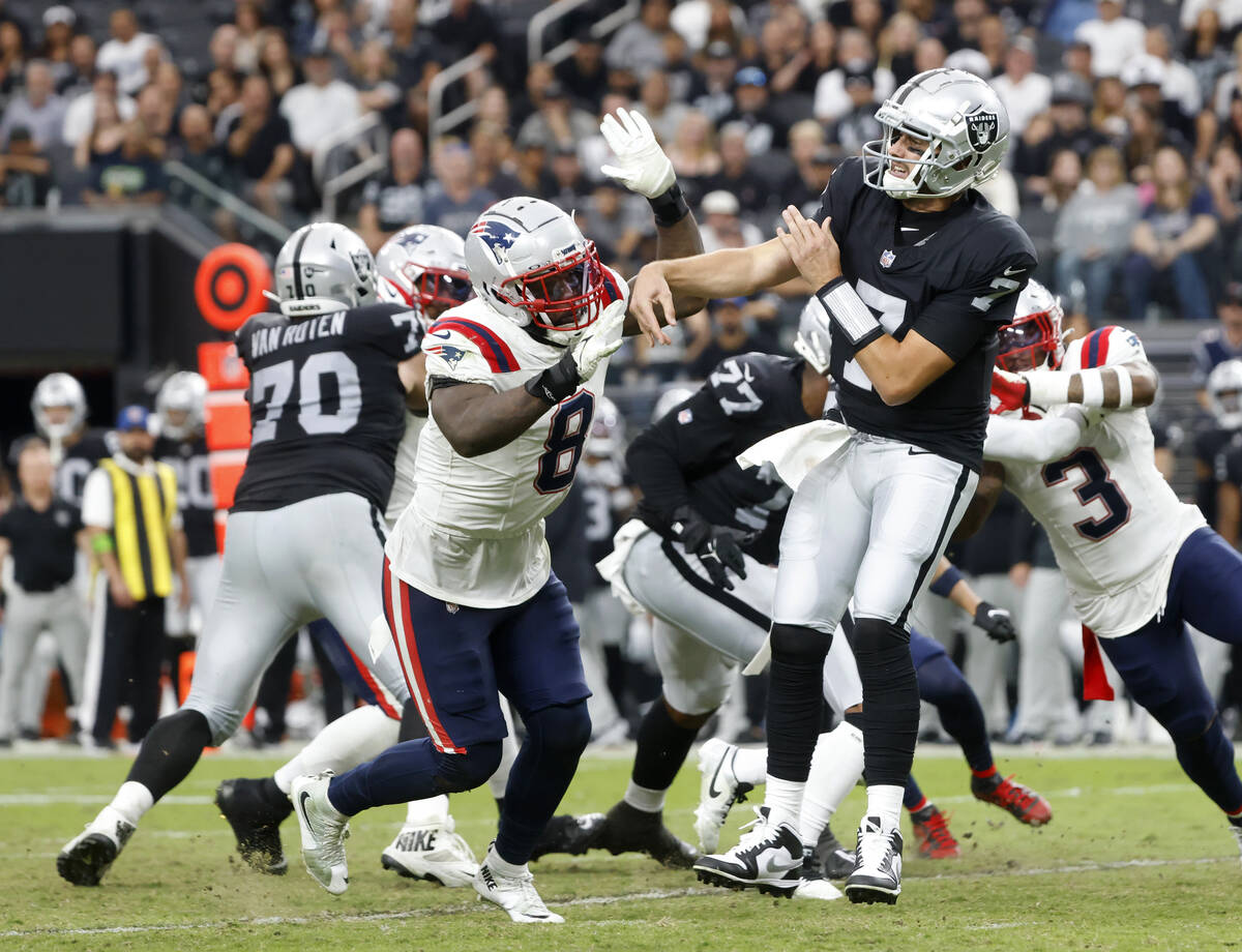 Raiders quarterback Brian Hoyer (7) throws under pressure against New England Patriots during t ...