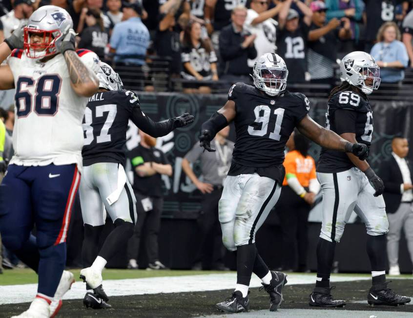 Raiders defensive tackle Bilal Nichols (91) reacts after sacking New England Patriots quarterba ...