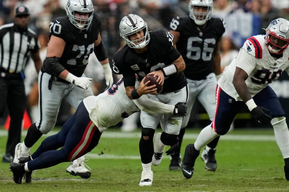 Las Vegas Raiders running back Josh Jacobs runs with the ball during the first half of an NFL f ...