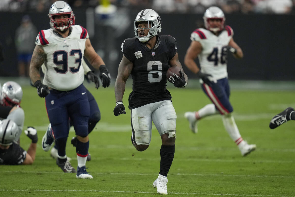 Las Vegas Raiders running back Josh Jacobs runs with the ball during the second half of an NFL ...