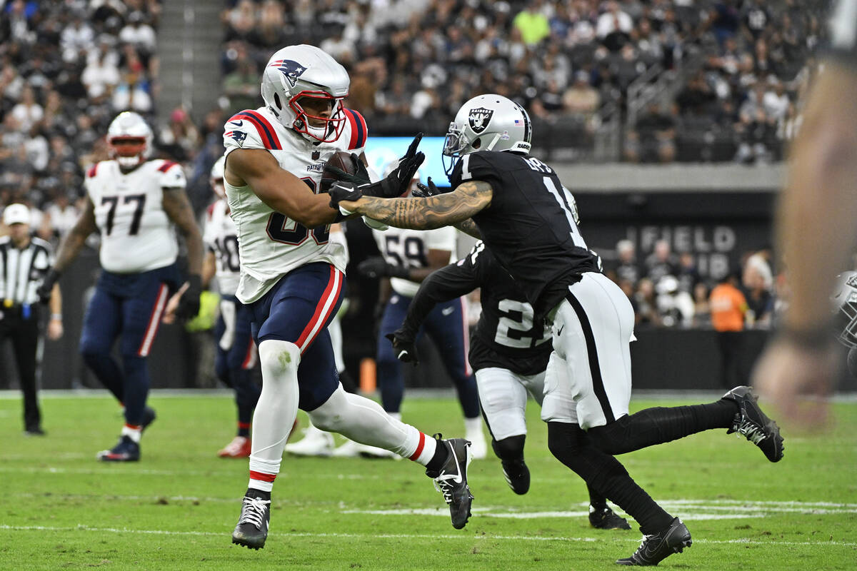 New England Patriots tight end Pharaoh Brown runs with the ball as Las Vegas Raiders safety Mar ...