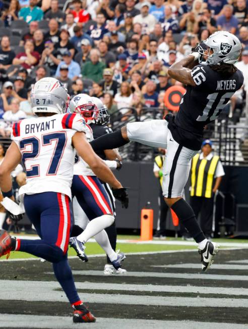 Raiders wide receiver Jakobi Meyers (16) comes down with a touchdown catch during the first hal ...