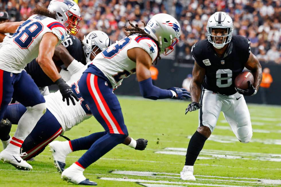 Raiders running back Josh Jacobs (8) runs with the ball during the first half of an NFL footbal ...