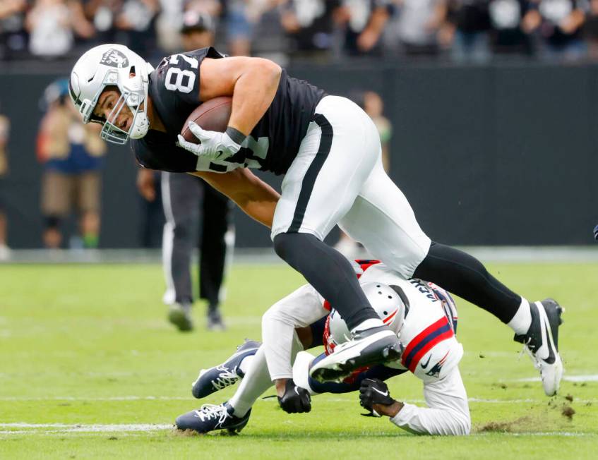 Raiders tight end Michael Mayer (87) avoids a tackle from New England Patriots cornerback Marcu ...