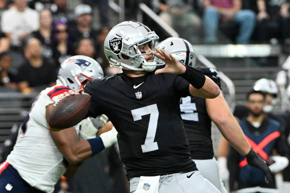 Las Vegas Raiders quarterback Brian Hoyer throws a pass during the second half of an NFL footba ...