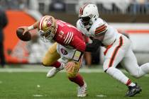 San Francisco 49ers quarterback Brock Purdy (13) is pressured by Cleveland Browns linebacker Je ...