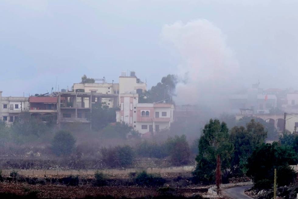 Smoke rises from artillery shell that hit the houses of Aita al-Shaab a Lebanese border village ...