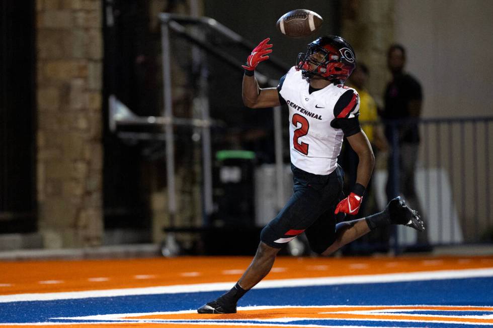 Centennial running back Cornell Hatcher, Jr. (2) scores a touchdown during the first half of a ...