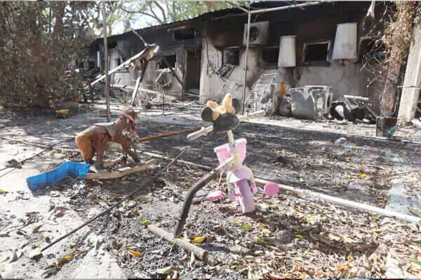 Debris outside a home in Nir Oz.