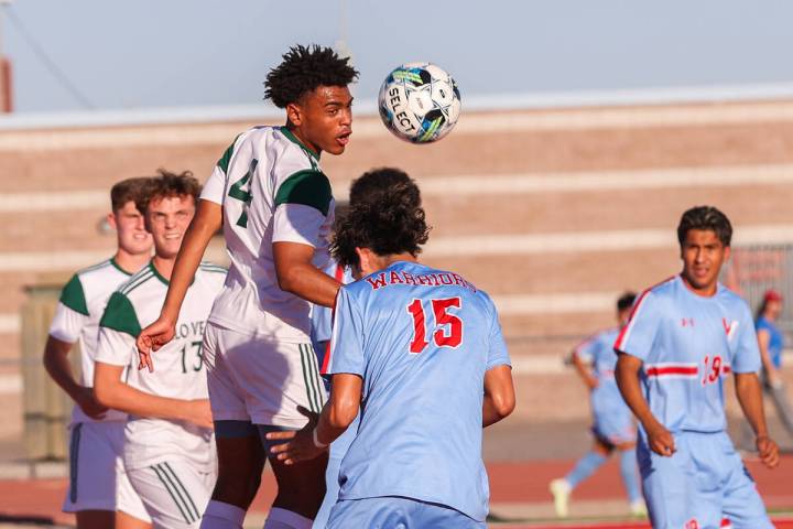 Palo Verde’s Ajani Smith (4) heads the ball during a soccer game between Palo Verde High ...