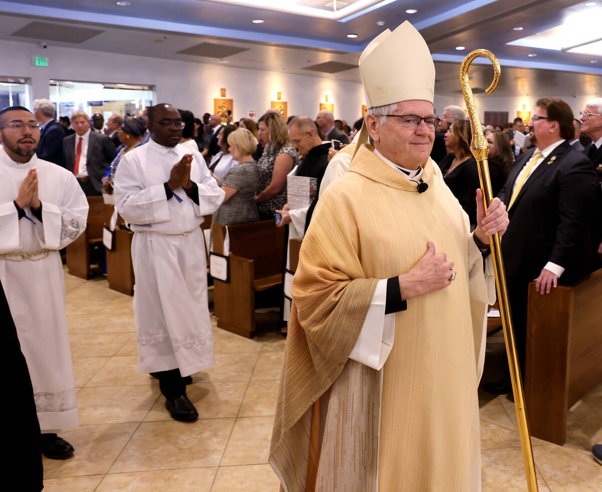 Archbishop George Leo Thomas walks in the procession during the imposition of the Pallium mass ...