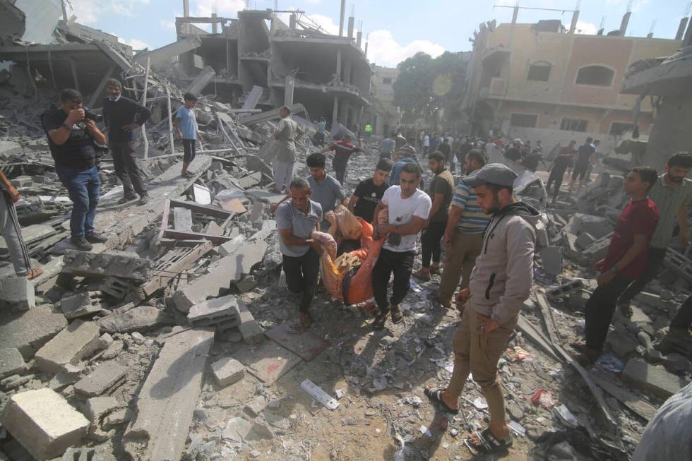 Palestinians evacuate wounded in Israeli bombardment of Rafah, southern Gaza Strip, Tuesday, Oc ...