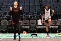 Las Vegas Aces forward Cayla George gives peace signs while warming up during a media availabil ...