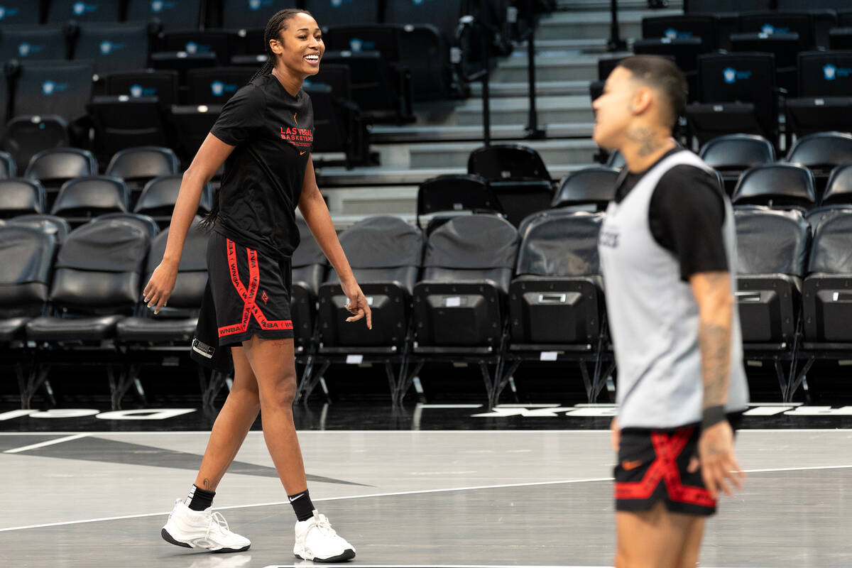 Las Vegas Aces center Alaina Coates, left, and guard Kierstan Bell warm up for practice during ...