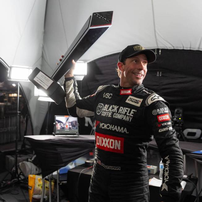Action sports star and Nitrocross racer Travis Pastrana poses with a championship trophy. The N ...