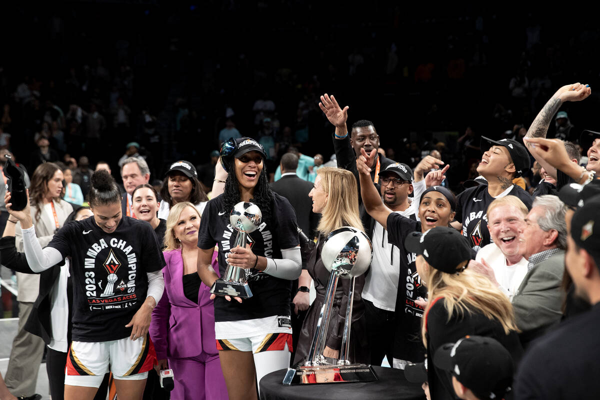 Las Vegas Aces forward A'ja Wilson (22) accepts the trophy for Most Valuable Player in her team ...