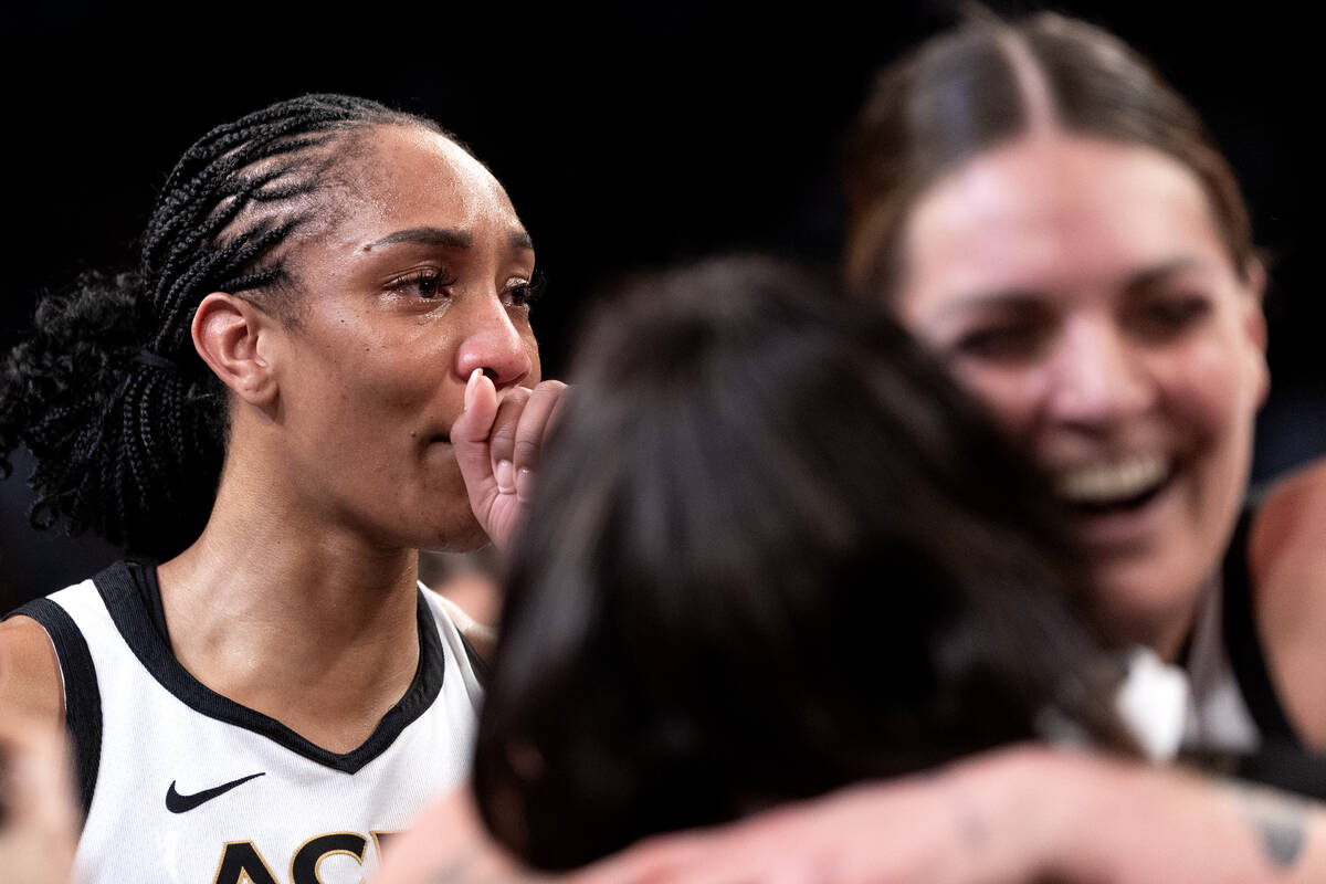 Las Vegas Aces forward A'ja Wilson, left, takes in the moment after winning Game 4 of a WNBA ba ...
