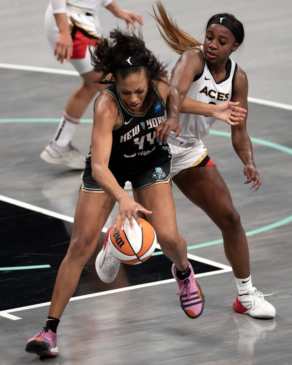 New York Liberty forward Betnijah Laney (44) dribbles against guard Jackie Young (0) during the ...