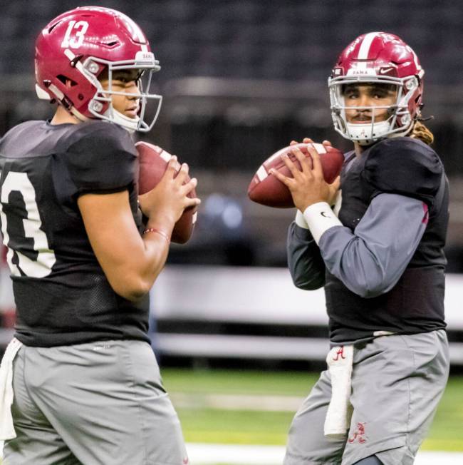 FILE - Alabama quarterbacks Tua Tagovailoa, left, and Jalen Hurts run a drill together at NCAA ...