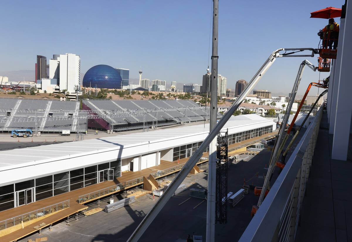 The grandstands, filled with seats, are seen as workers add the finishing touches to the F1 Pit ...