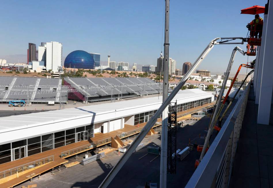 The grandstands, filled with seats, are seen as workers add the finishing touches to the F1 Pit ...