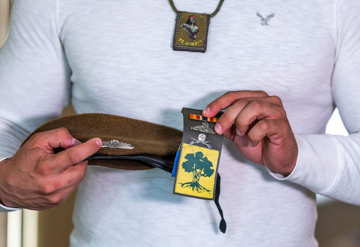 Ariel Salley shows off his beret and badges from his past while serving in the Israeli army, no ...