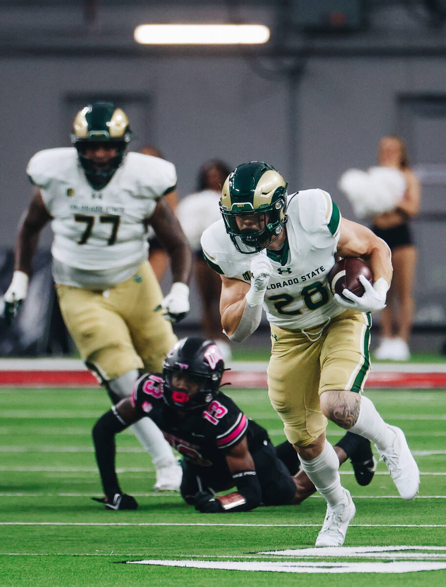 Colorado State running back Vann Schield (28) runs down the field with the ball as UNLV defensi ...