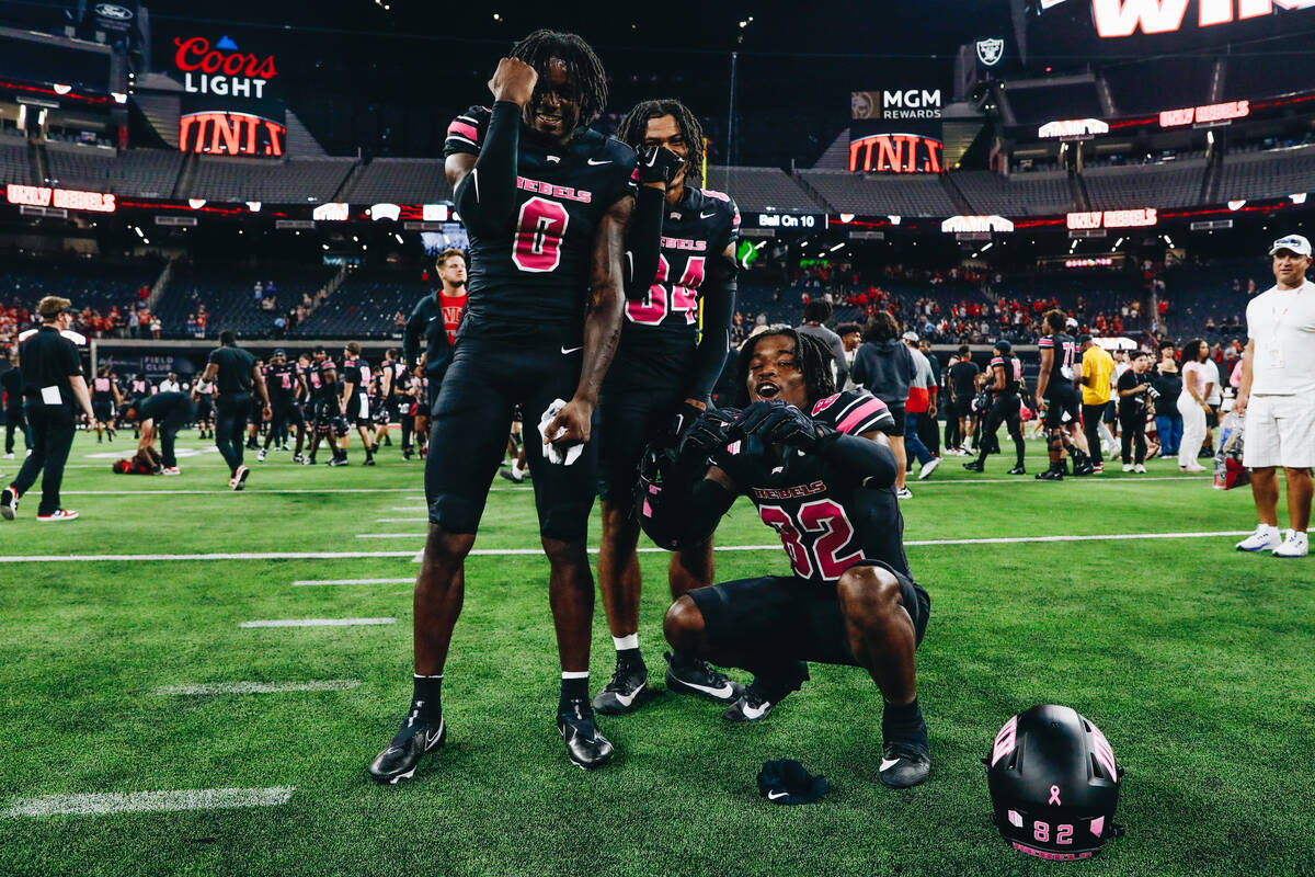 UNLV players pose for a photograph after beating Colorado State and becoming bowl eligible at A ...