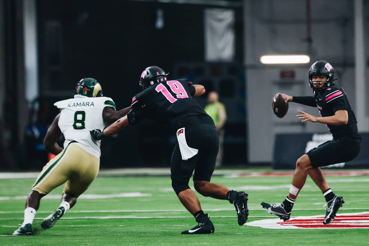 UNLV quarterback Jayden Maiava (1) runs with the ball as he looks to throw it to a teammate dur ...