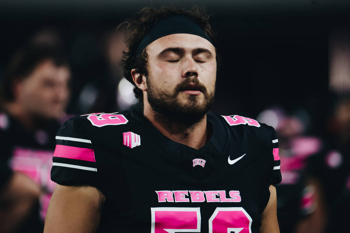UNLV long snapper Walker Hardan (59) takes a deep breath as the clock winds down during a game ...