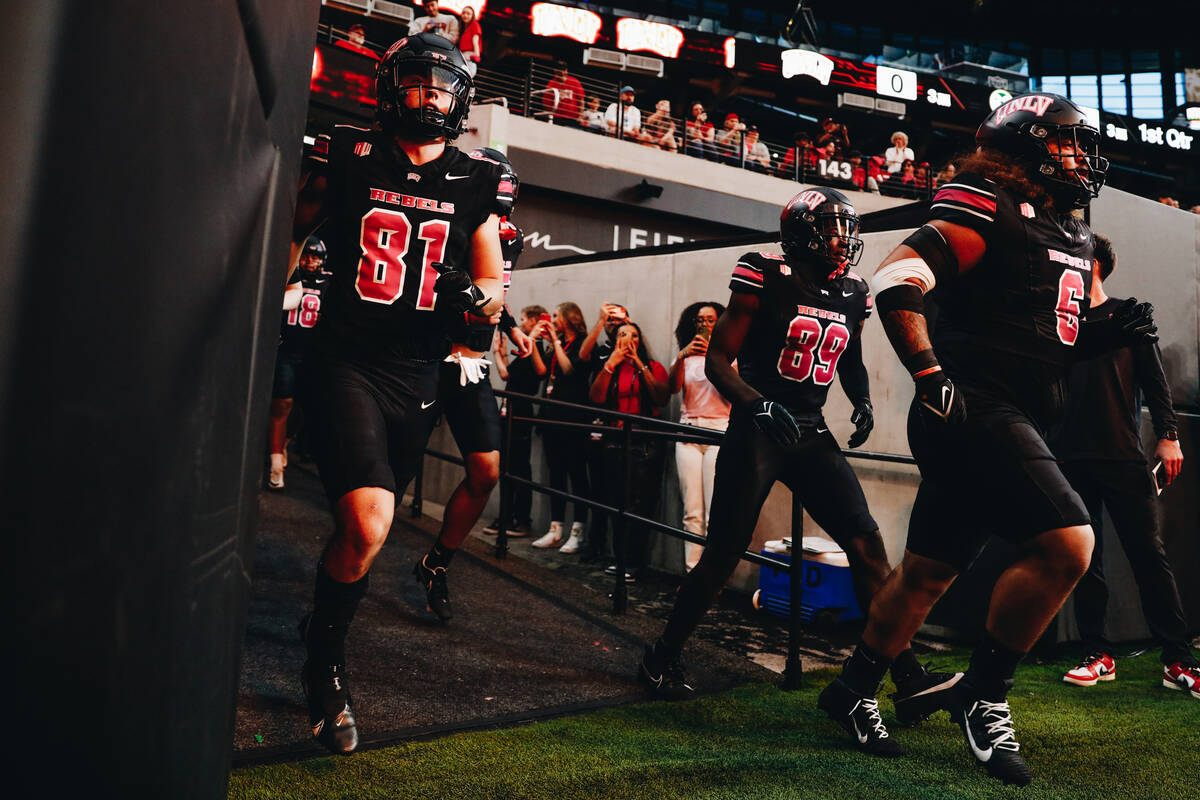 UNLV players make their way onto the field before a game against Colorado State at Allegiant St ...