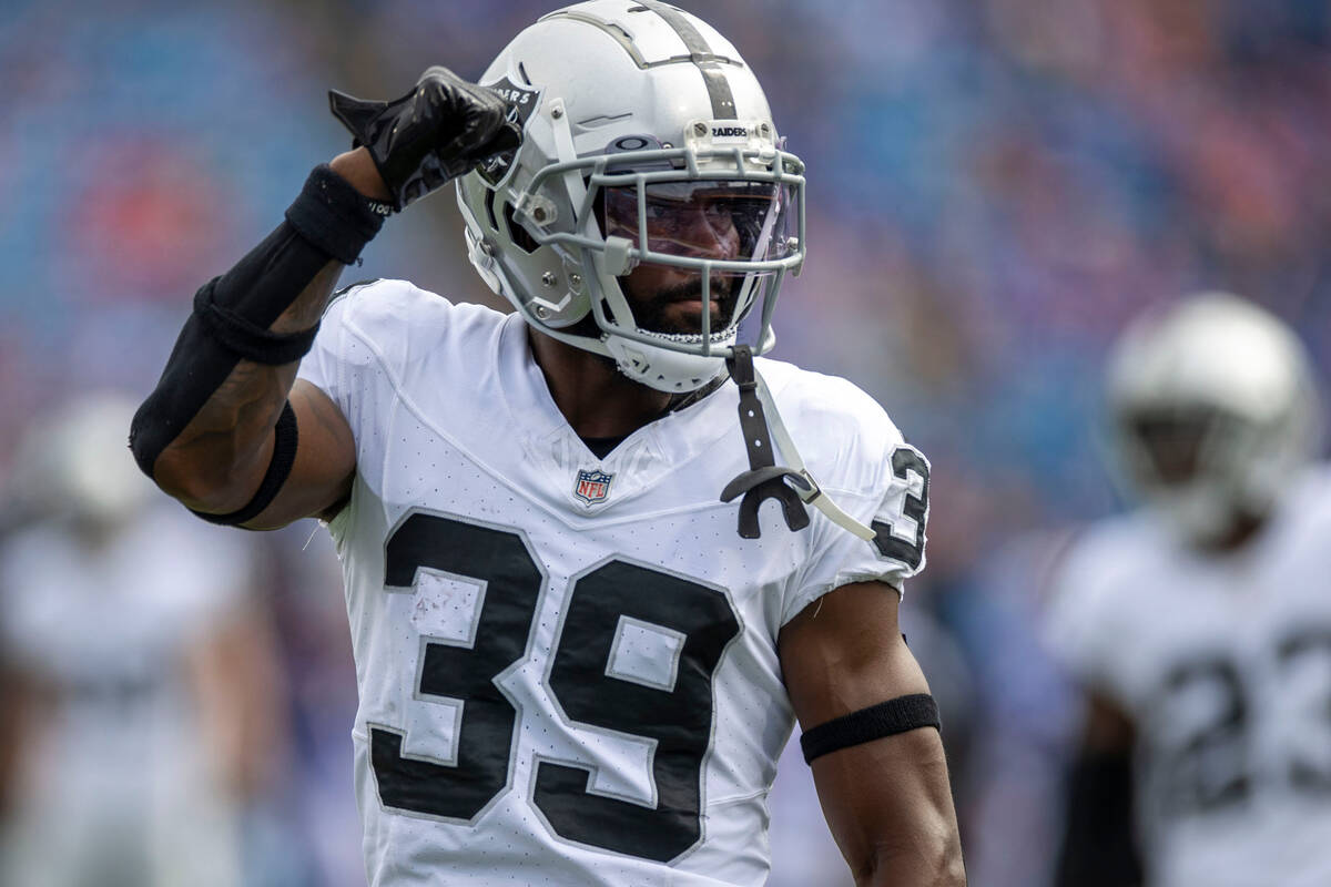 Raiders cornerback Nate Hobbs (39) fist pumps to the fans before an NFL game against the Buffal ...