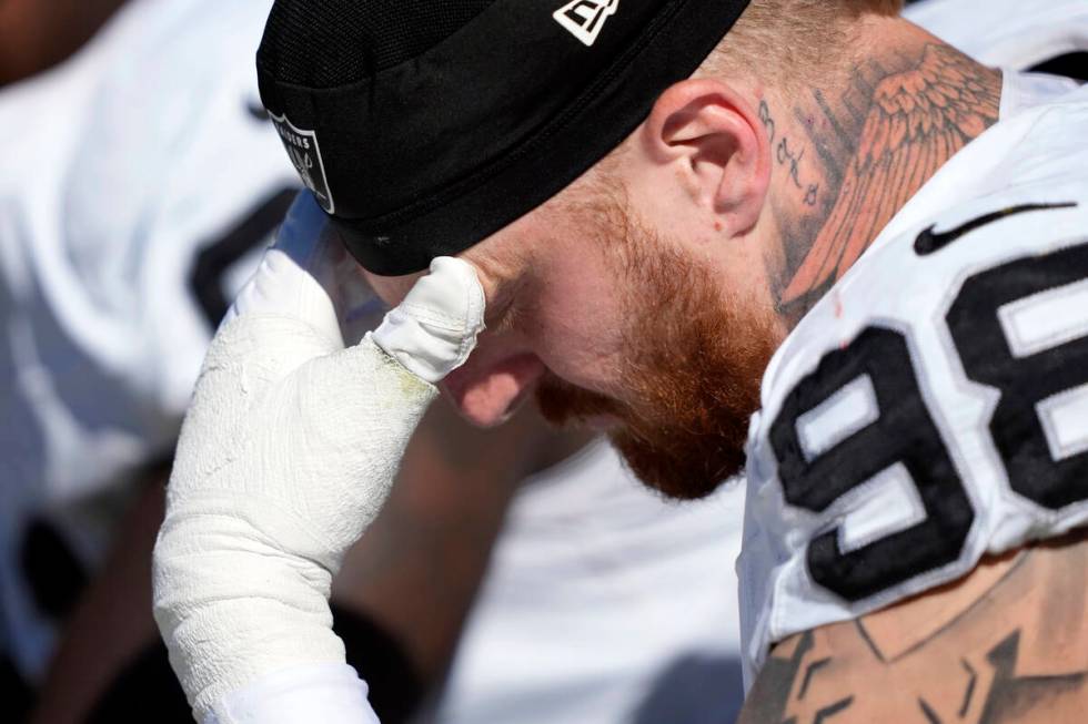 Las Vegas Raiders defensive end Maxx Crosby (98) sits on the sideline in the first half of an N ...