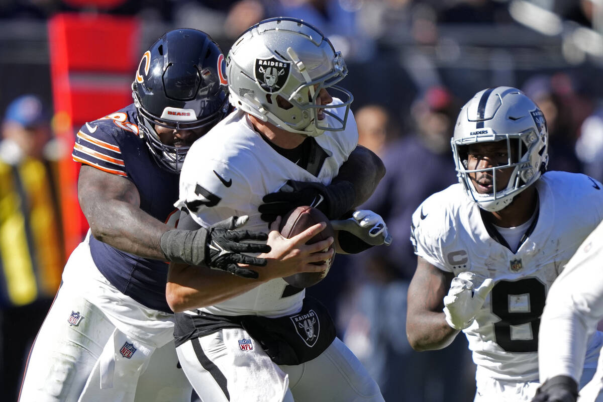 Chicago Bears defensive tackle Justin Jones (93) sacks Las Vegas Raiders quarterback Brian Hoye ...