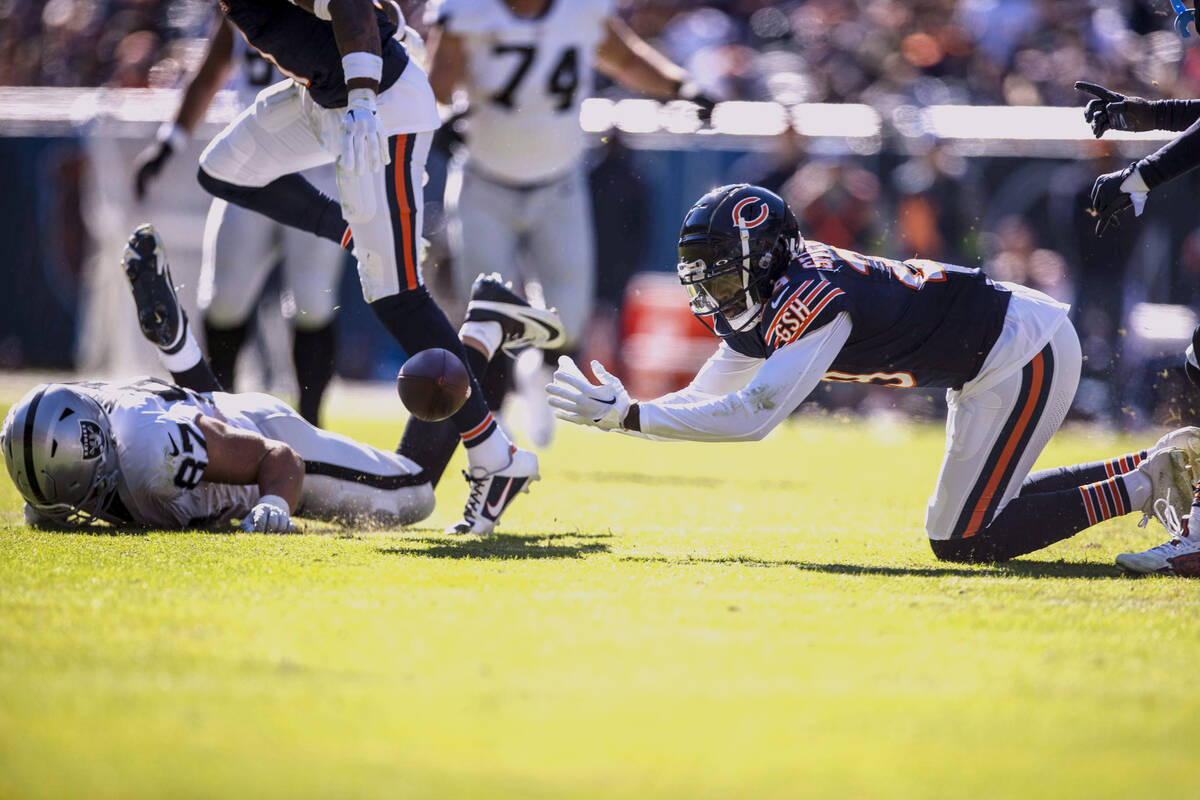 Chicago Bears cornerback Tyrique Stevenson (29) reaches for a pass that Raiders tight end Micha ...