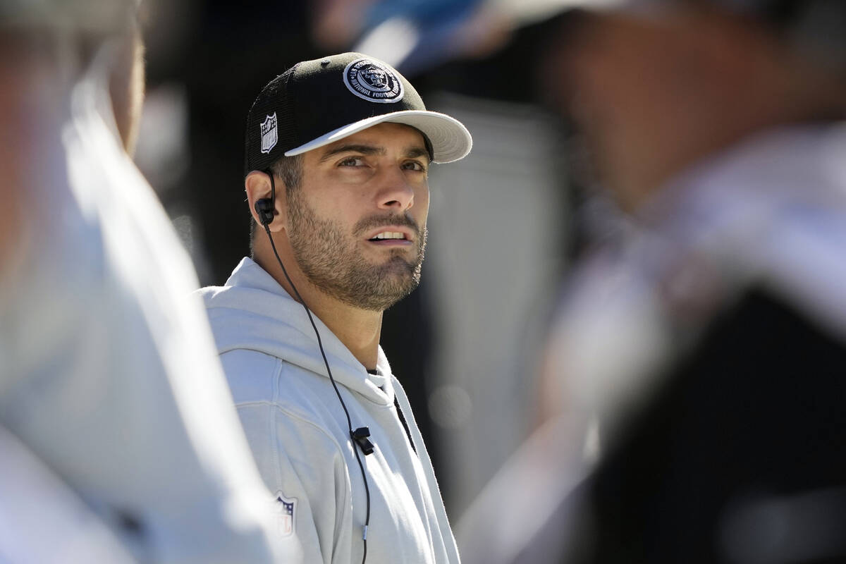 Las Vegas Raiders quarterback Jimmy Garoppolo watches from the sideline in the first half of an ...