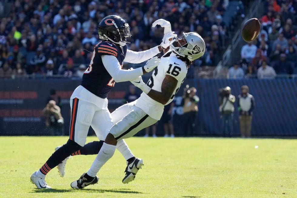 Chicago Bears cornerback Tyrique Stevenson, left, breaks up a pass intended for Las Vegas Raide ...