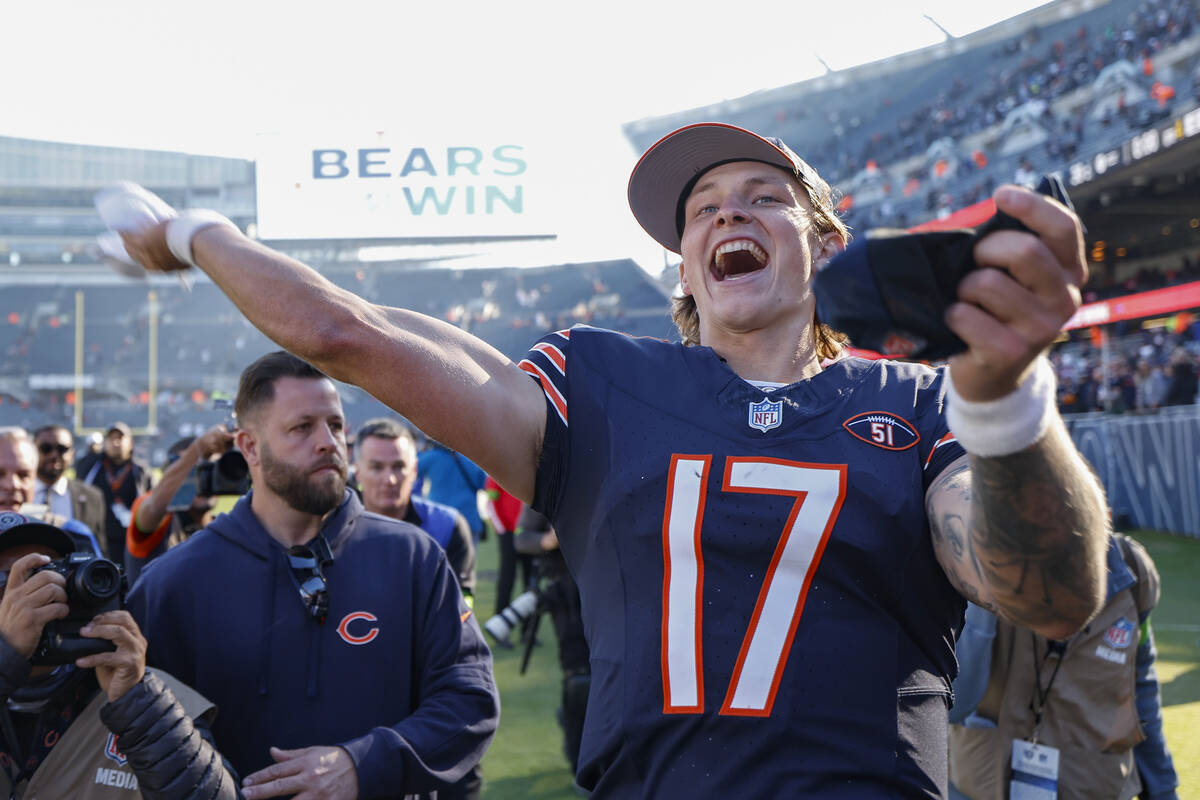 Chicago Bears quarterback Tyson Bagent celebrates as he leaves the field after his team defeate ...