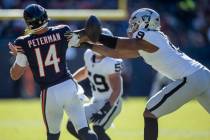 Raiders defensive end Tyree Wilson (9) gets a strip sack on Chicago Bears quarterback Nathan Pe ...