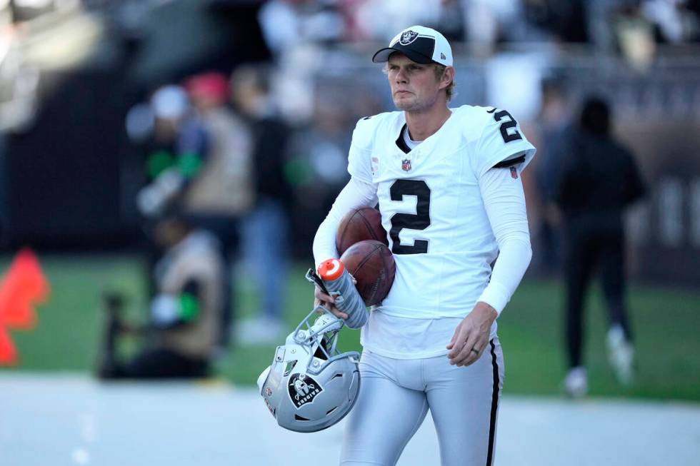 Las Vegas Raiders kicker Daniel Carlson warms up before an NFL football game against the Chicag ...