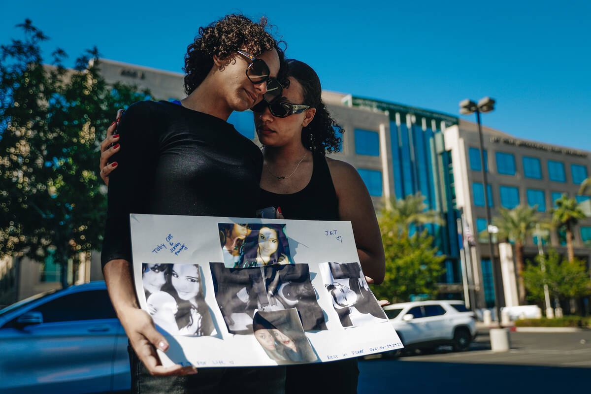 Judith Vaughs, right, comforts her sister, Madeleine Howell, during a demonstration in memory o ...