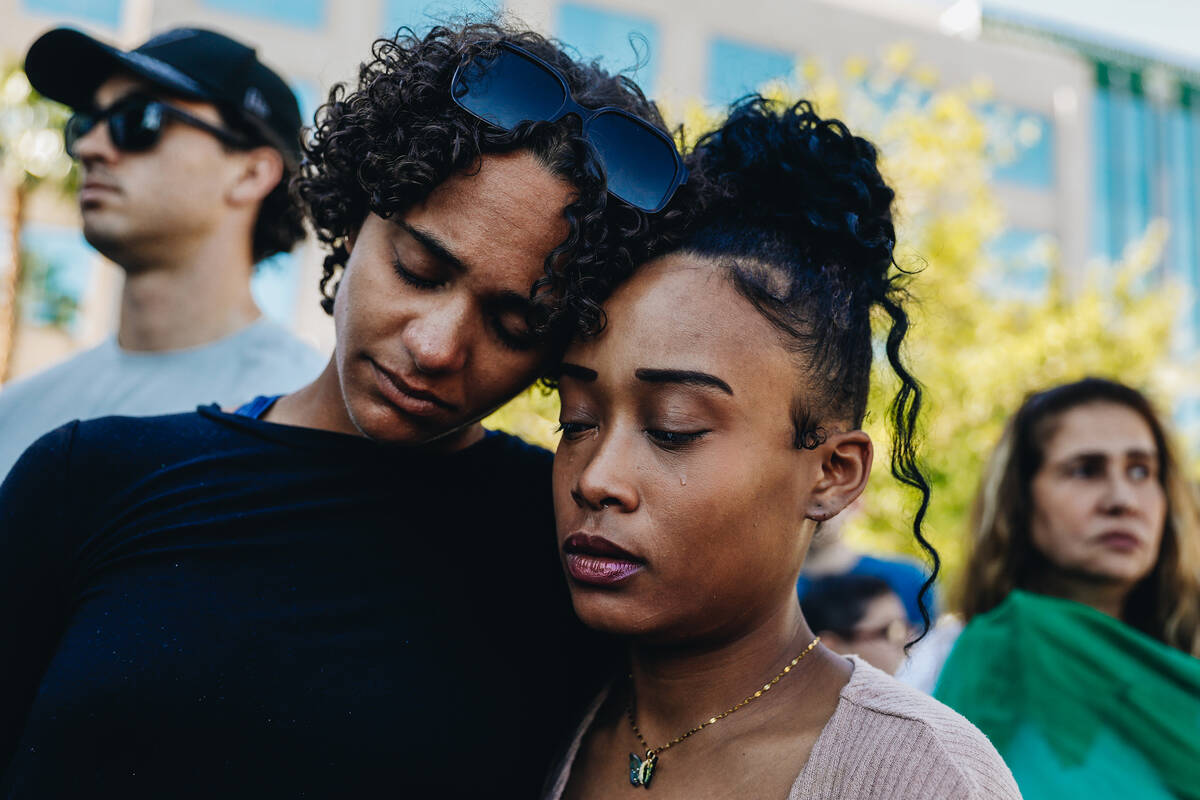 Madeleine Howell, left, comforts Kenya Sled during a demonstration in memory of Tabatha Tozzi a ...