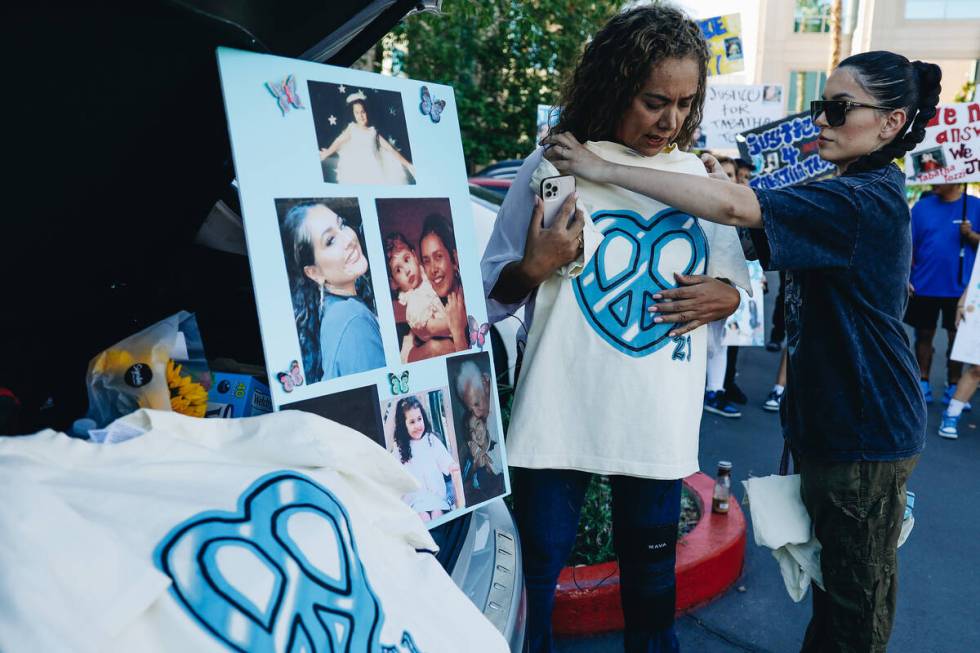 Alicia Lozoya, right, gives Regina Lacerda, the mother of Tabatha Tozzi, a shirt in honor of he ...