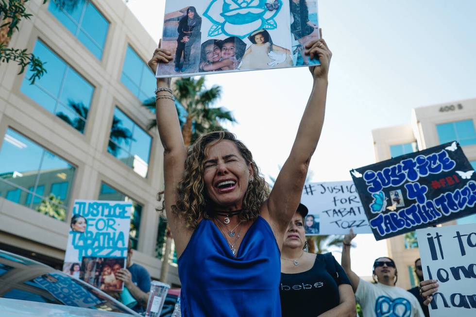 A mourner cries as they hold up a sign during a demonstration in memory of Tabatha Tozzi at Met ...