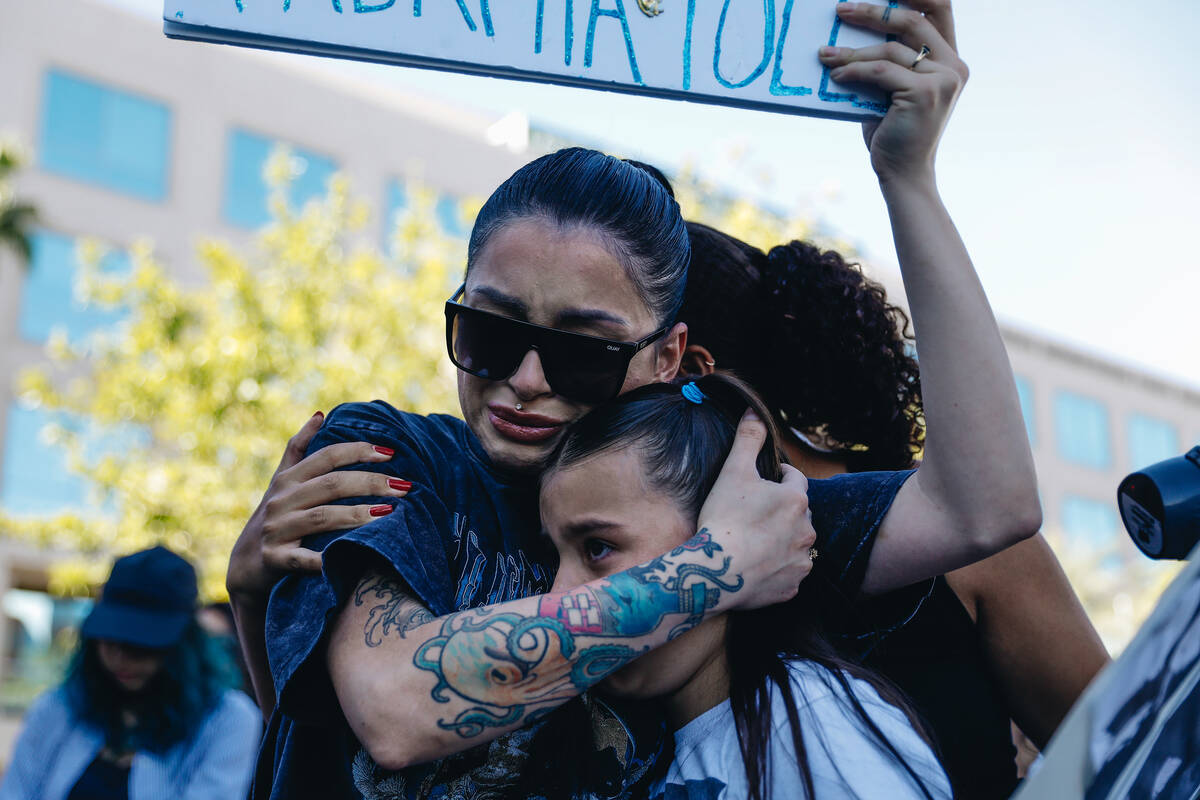 Alicia Lozoya, left, holds onto Macy Diaz, 8, as they get emotional during a demonstration in m ...