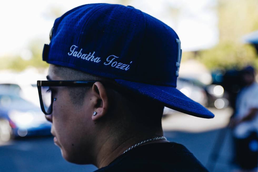 A person wears a hat with Tabatha Tozzi’s name embroidered into it during a demonstratio ...